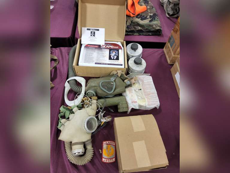 Group: gas masks, filters, US Army patch, NIP Baby Scape Hood, Case of Optical Inserts for M17 CB masks, & other