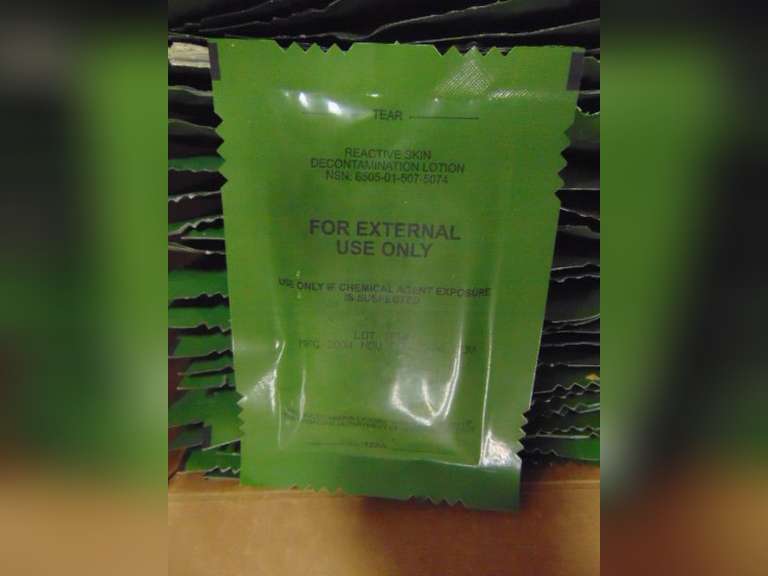 Box with packs of decontamination lotion
