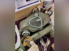 Group: gas masks, filters, US Army patch, NIP Baby Scape Hood, Case of Optical Inserts for M17 CB masks, & other
