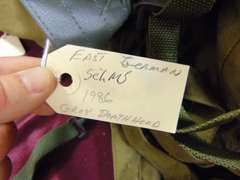 Group of various gas mask bags (some with contents, masks are missing)