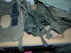 Group: Military winter coat & pants, frame/harness for a AN/PRC-77 portable radio, & other SEE PICS
