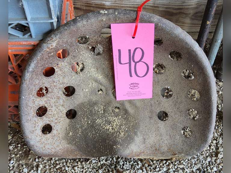 Metal tractor seat