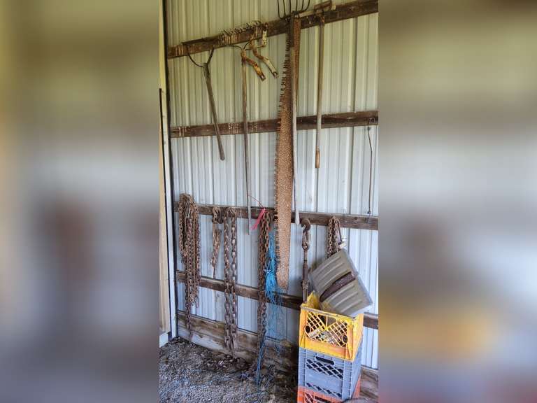 Group misc: chains, hand saw, yard tools, crates & other  (tractor seat NOT included)