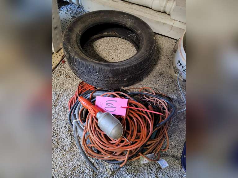 Group of ext cords, light, tire & other