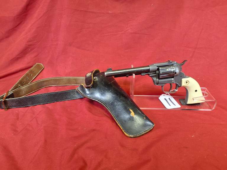 Hi-Standard Mod: Double Nine W-100, 22cal revolver, Ser#: 635209 , 5-1/2" brl, white grips, 9 shots, d.a., leather holster, 93%