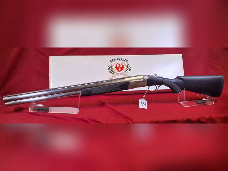 Ruger Mod: Red Label, 12ga over under shotgun, Ser#: 411-49548 , 26" vr brl, 3" chamber, all weather model, stainless brl receiver, black syn stocks, box, 5 choke tubes & wrench, unfired (NEW in box) 99%