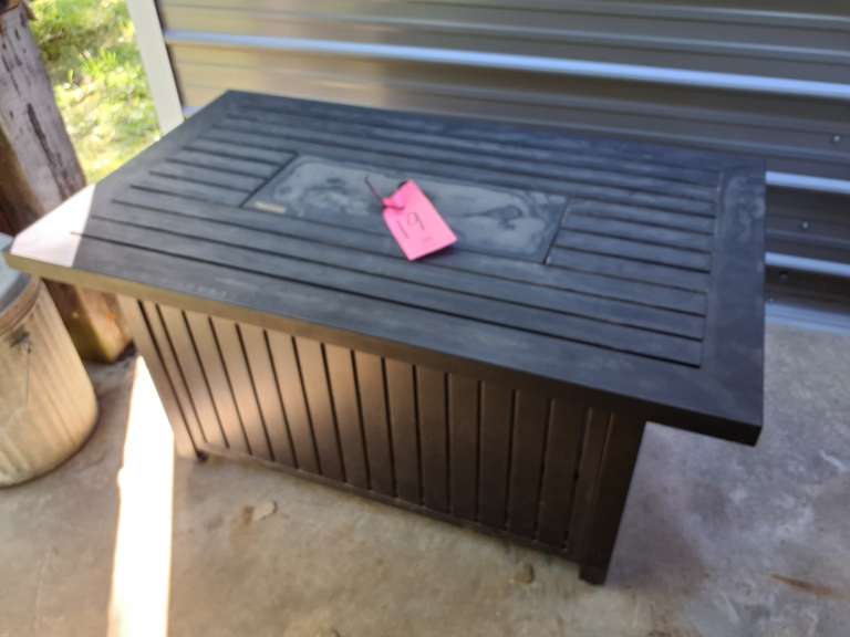 Metal patio table with fire pit in the middle (has propane tank, level unknown, may be empty) approx 28.5" x 48"x 24.5" (untested)