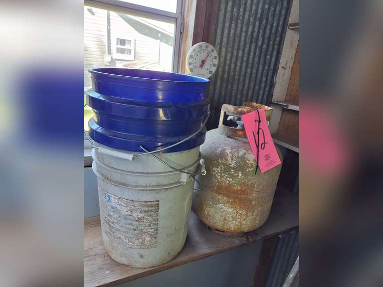 Propane tank (level unknown, may be empty) & 3 buckets