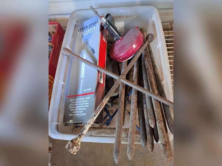 Bin with drain snake, lug wrench, lever-steel pump, & other SEE PICS