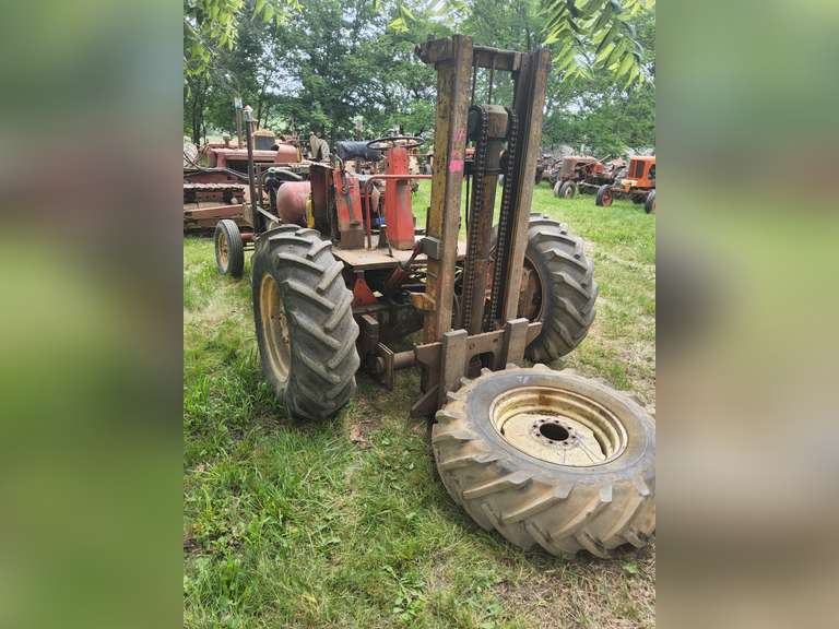 Custom Made Forklift, Rough Terrain, 62 olds V8 engine, 4spd trans mated to old auto car trans, Case combine frt. axle, Cordoba rear end, RUNS/OPERATES -- NEEDS STEERING WORK