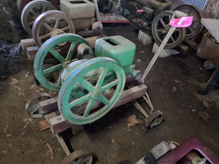 John Deere 1.5HP, 500 rpm, Type E hit miss engine, 18" fly wheels, mounted on 4 wheel trolley cart