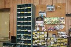 3 HARDWARE BINS WITH HARDWARE, DOOR HARDWARE, BOLTS, WASHERS, ETC.