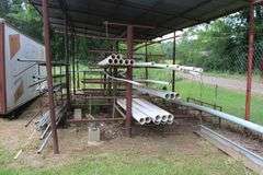 ALL PIPE ON RACKS LOCATED BEHIND BUILDING OUTSIDE