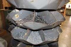 ROTATING NAIL BIN WITH SCALES AND INVENTORY IN THE BINS