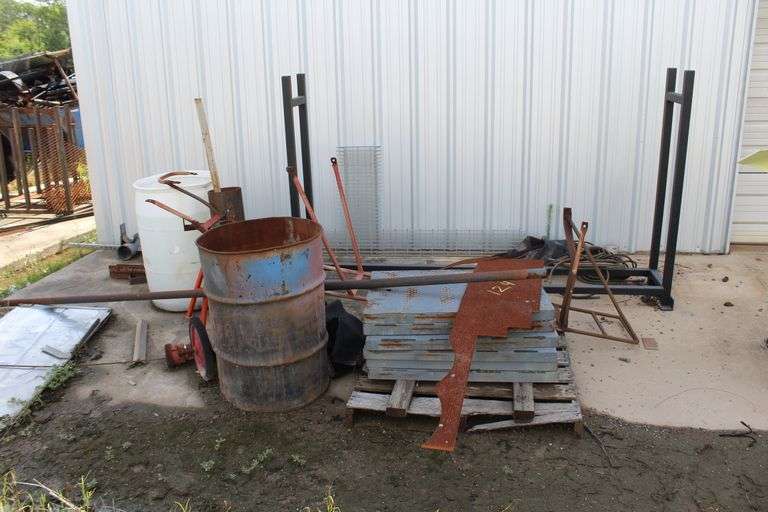 PIPE RACK & SCRAP METAL IN FRONT OF SHOP
