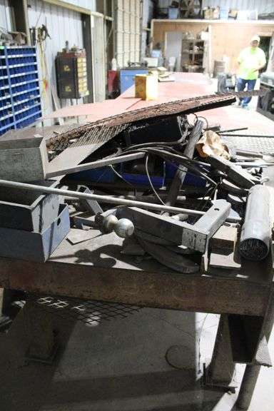 24' LONG 4' WIDE METAL TABLE WITH CONTENTS UNDER TABLE