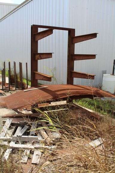 METAL RACK OUTSIDE OF SHOP WITH CONTENTS