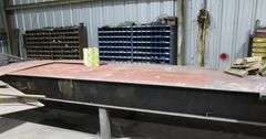 24' LONG 4' WIDE METAL TABLE WITH CONTENTS UNDER TABLE