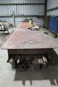 24' LONG 4' WIDE METAL TABLE WITH CONTENTS UNDER TABLE