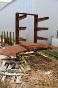 METAL RACK OUTSIDE OF SHOP WITH CONTENTS