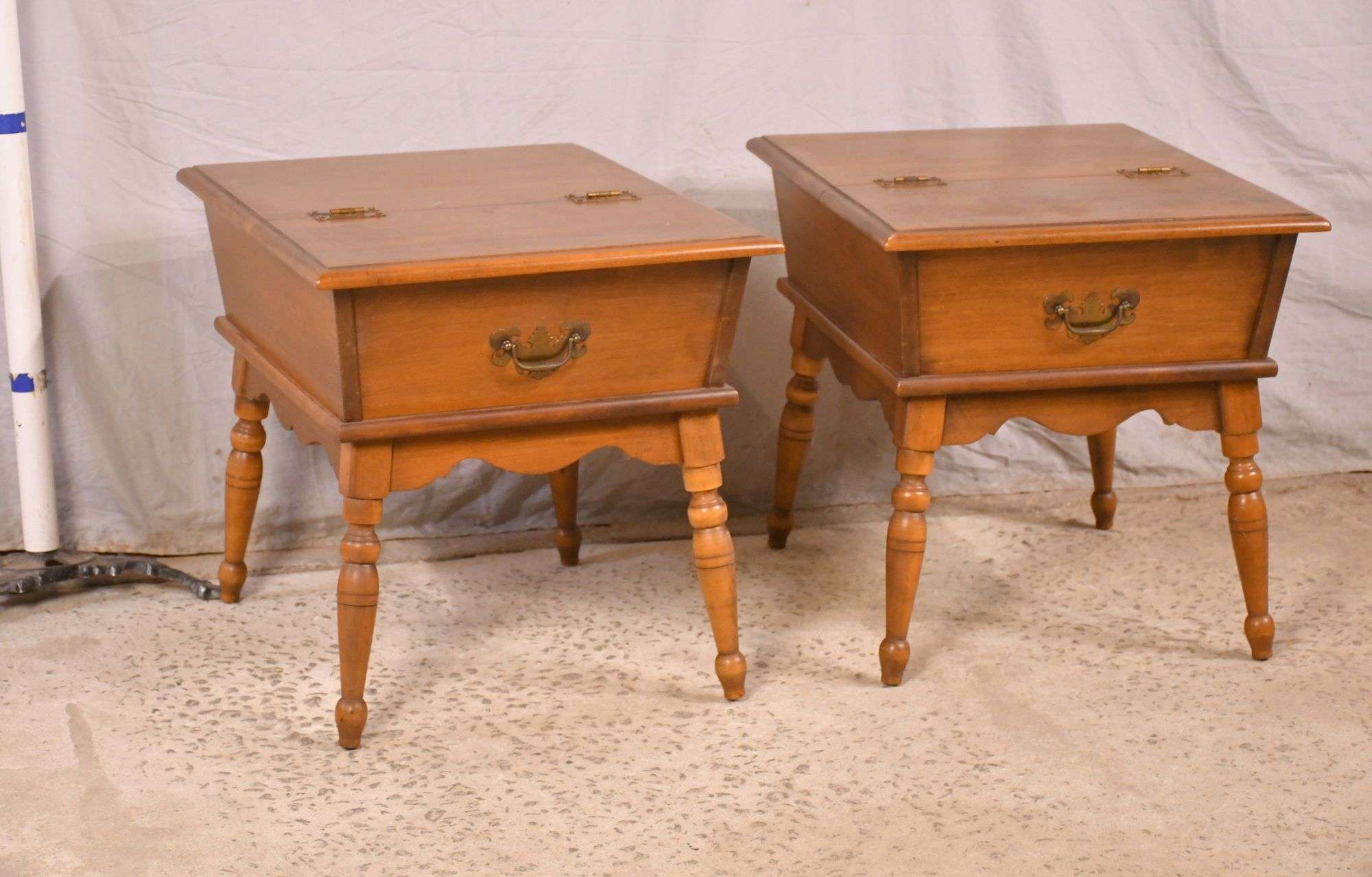 Pair of Heywood-Wakefield lift-top end tables with turned