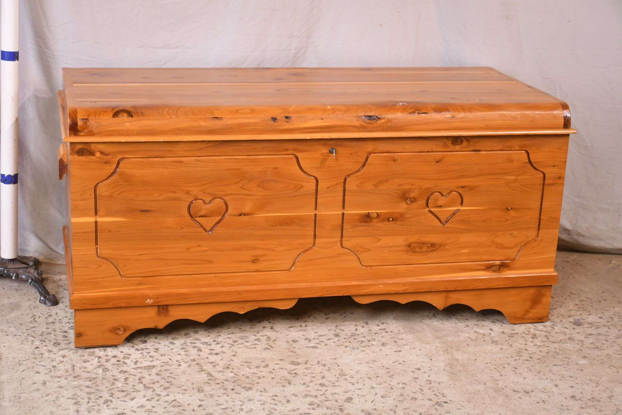 Lift-top cedar chest with heart designs on front; 74-10557