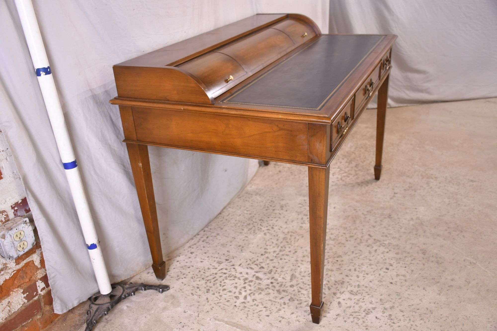 Hekman cherry cylinder roll-top desk with spade feet; 74