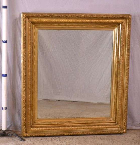 Large mirror with ornate gold frame; 971-158