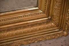 Large mirror with ornate gold frame; 971-158