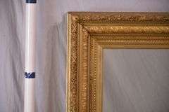 Large mirror with ornate gold frame; 971-158