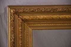 Large mirror with ornate gold frame; 971-158
