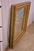 Large mirror with ornate gold frame; 971-158
