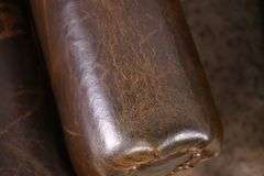 Pair of Paul Robert distressed brown leather wingback armchairs; 336-3831