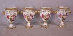 Set of 4 Chelsea House small porcelain urns with floral designs; 15961-239