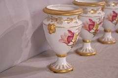 Set of 4 Chelsea House small porcelain urns with floral designs; 15961-239