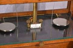 Becker Brothers balance scales in mahogany and glass single drawer case; 697-1435