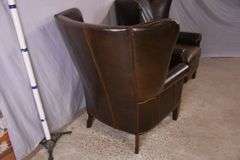 Pair of Paul Robert distressed brown leather wingback armchairs; 336-3831