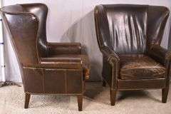 Pair of Paul Robert distressed brown leather wingback armchairs; 336-3831