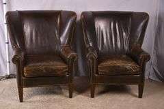 Pair of Paul Robert distressed brown leather wingback armchairs; 336-3831
