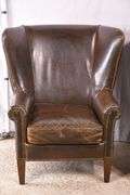 Pair of Paul Robert distressed brown leather wingback armchairs; 336-3831