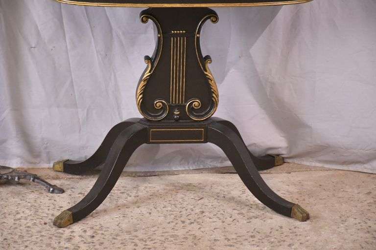 Mahogany flip-top game table with black and gold lyre pedestal base; 495-313