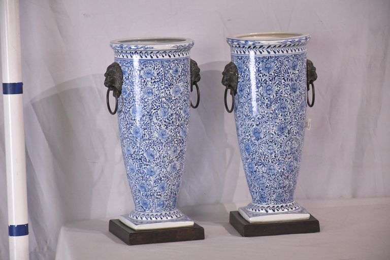 Pair of blue and white ceramic vases with bronze lion head adornments; 6117-017