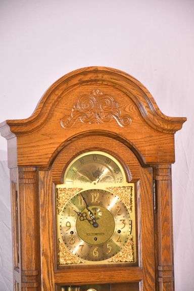 Howard Miller grandfather clock with oak case; 16748-006