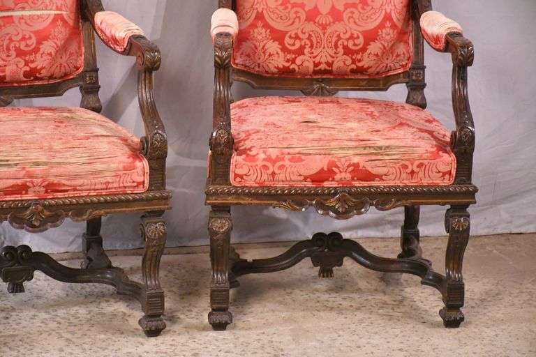 Pair of carved walnut open armchairs; 68-5084
