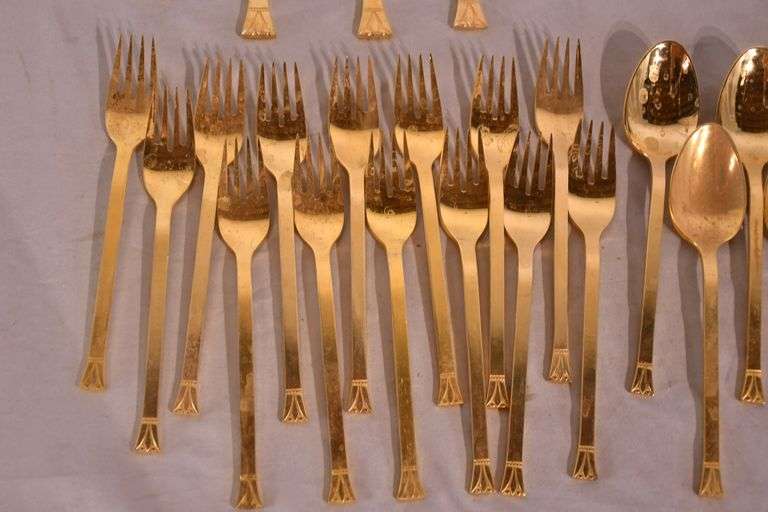 SRI "Royalty" gold toned stainless flatware set; 14-2666