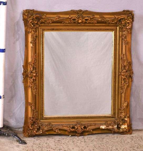Mirror with ornate gold frame; 74-11631E