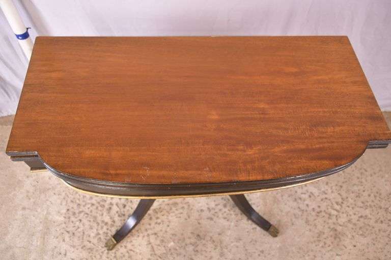 Mahogany flip-top game table with black and gold lyre pedestal base; 495-313