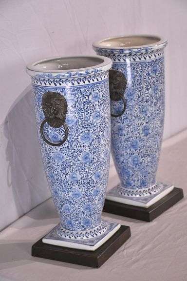Pair of blue and white ceramic vases with bronze lion head adornments; 6117-017