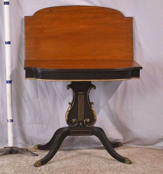 Mahogany flip-top game table with black and gold lyre pedestal base; 495-313