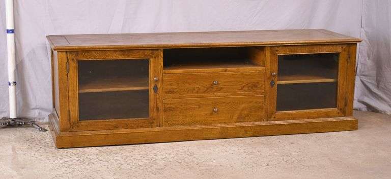 Oak entertainment credenza with 2 glass doors and 2 drawers; 55-11214